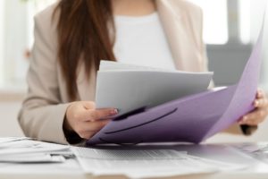 young-adult-organizing-documents_23-2149396653-2