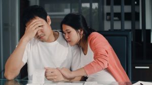 young-asian-pregnant-couple-records-income-expenses-home-dad-worried-serious-stress-while-record-budget-tax-financial-document-working-living-room-home_7861-2204